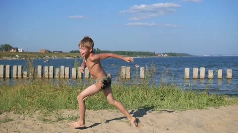 Child running on beach sand Video stock 66515197