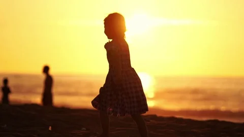 Child Running on Beach At Sunset in Slow Motion ( Oahu Hawaii ) Stock Footage 74055377