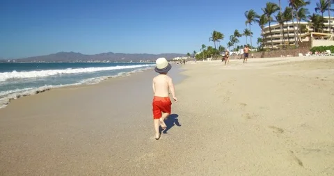 Child running on the sand.  Stock Footage 102690481