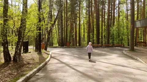 Child running in the spring forest Stock Footage 242315175