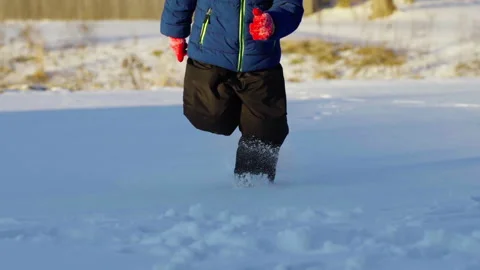 Child Running Through Snow Stock Footage 302532602