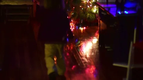 Child running toward Christmas tree Stock Footage 71163887