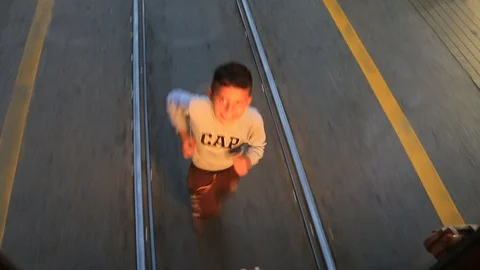 Child running for the tram Stock Footage 96395487