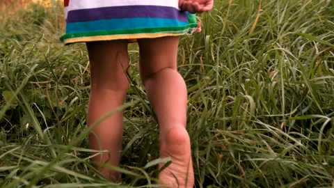 A child runs on the grass. Selective focus. Stock Footage 273584947