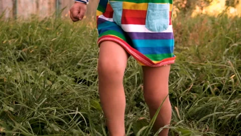 A child runs on the grass. Selective focus. Stock Footage 275028321