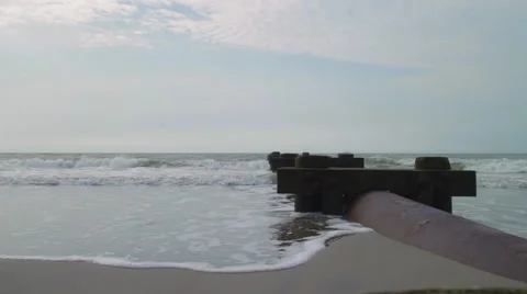 Child runs torwards the Ocean Stock Footage 68944361