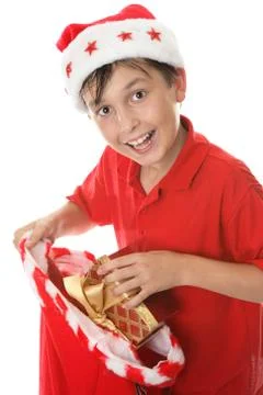 Child with a sack of presents Stock Photos
