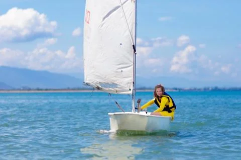 Child sailing. Kid learning to sail on sea yacht. 스톡 사진