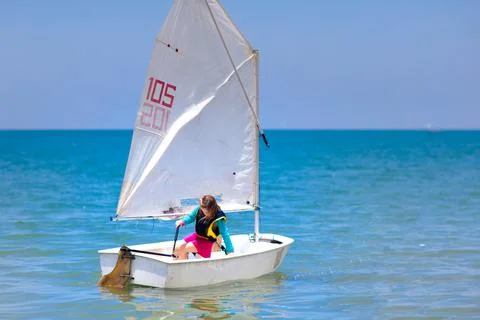 Child sailing. Kid learning to sail on sea yacht. Stock-Fotos