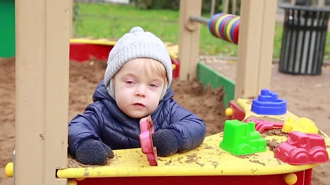 Child in the sandbox Stock Footage 142144220