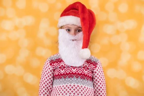 Child in Santa Claus hat and with beard Stock Photos