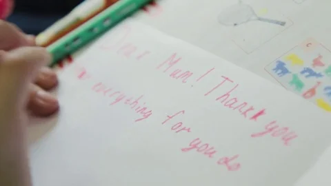 Child at school drawing and writing Stock Footage 80274005