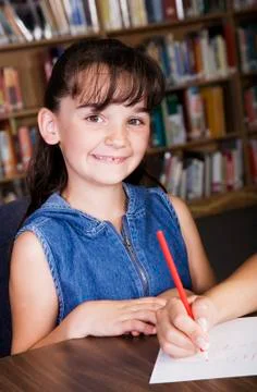 Child in school library Stock Photos