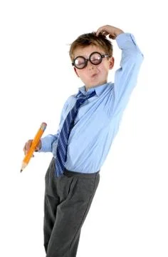 Child scratching his head for an answer Stock Photos