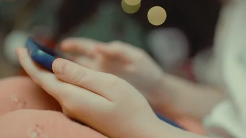 Child scrolls the phone closeup Stock Footage 301982627