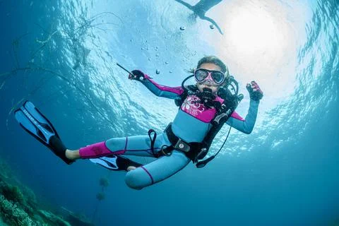 Child scuba diver underwater in the ocean Stock Photos