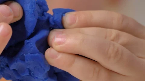 Child is sculpting with modeling clay Stock Footage 128177547