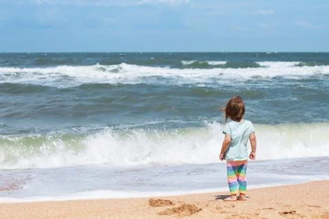 Child on the seaside Stock Photos