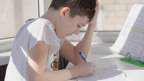 Child self-studying at home during epidemc, distance studying Video stock 128241053