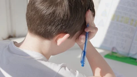 Child self-studying at home during epidemc, distance studying Stock Footage 128241086