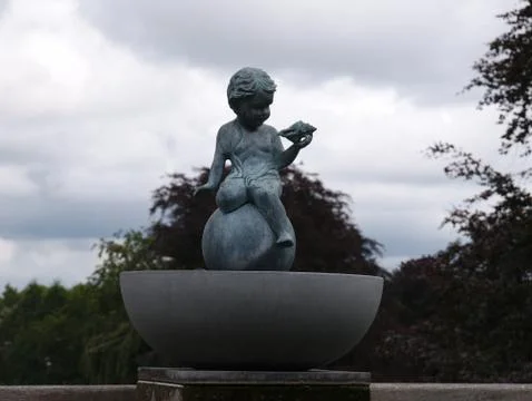 Child with shell statue Stock-Fotos