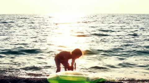 Child is on shore HD Video stock 10704612