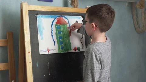 Child shows his drawing Stock Footage 81473798