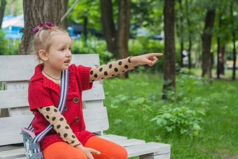 The child sits on a bench Stock Photos