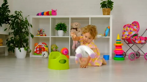 The child sits on the potty. Selective focus. Stock Footage 216549334