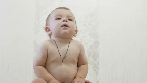 A child sitting on a pot Stock Footage 151087443