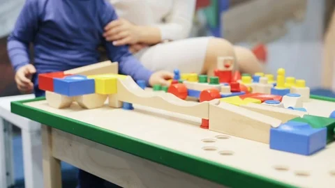 The child is sitting at a reception with a psychologist Stock Footage 80989780