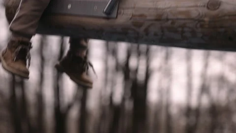 Child sitting on a swing close-up shot Stock-Footage 152302566