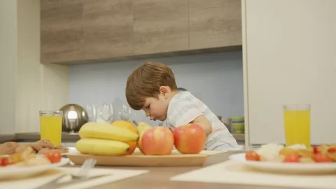 Child sitting at the table Stock Footage 100001084