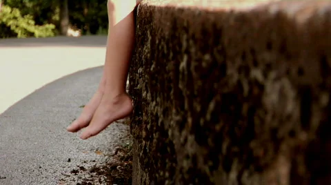 Child Sitting on a Wall Stock Footage 372048