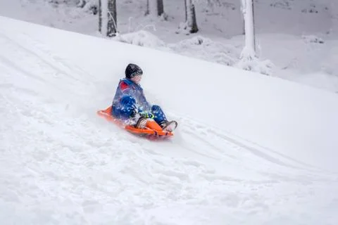 Child sledding Stock Photos