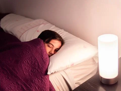 Child Sleeping in Bed with Soft Light Stock Photos