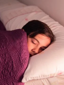 Child Sleeping in Bed with Soft Light Stock Photos