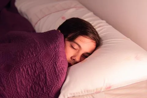 Child Sleeping in Bed with Soft Light Stock Photos