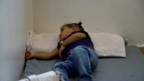 A Child Sleeping on a Mat on the Floor co Stock Footage 120929040