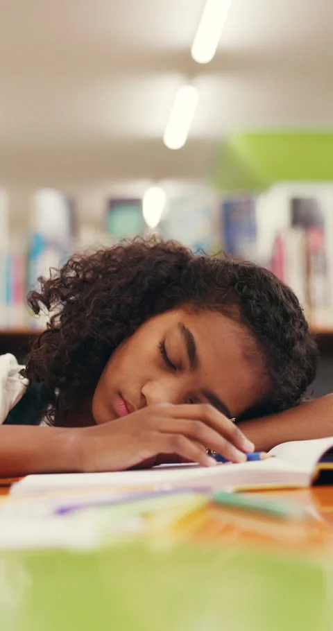Child, sleeping or tired in library with homework stress, education burnout or Stock Footage 320173090