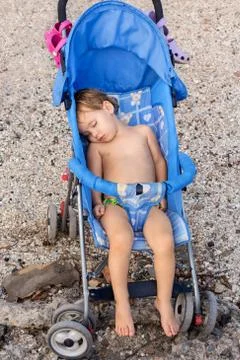 Child is sleeping in the stroller Stock Photos
