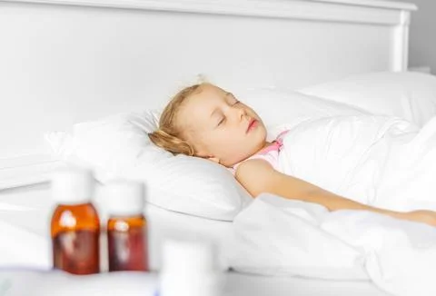 The child sleeps when sick. Stock Photos