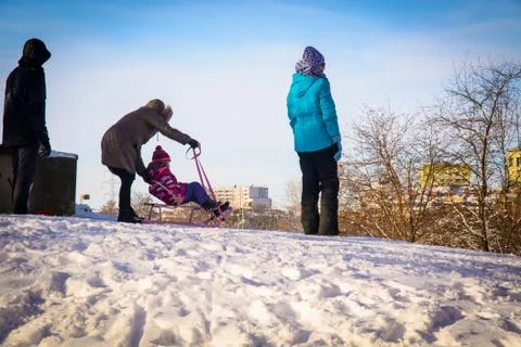 Child on sleigh Stock-Fotos