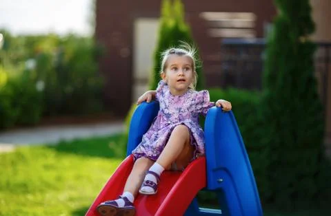 Child on slide Stock Photos