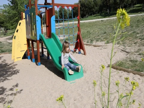 Child sliding at playground Stock Footage 76782347