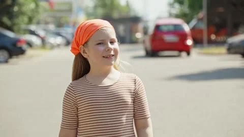 Child smiles at camera. Beautiful face. Little girl smiling and looking happy. Stock Footage 246185984