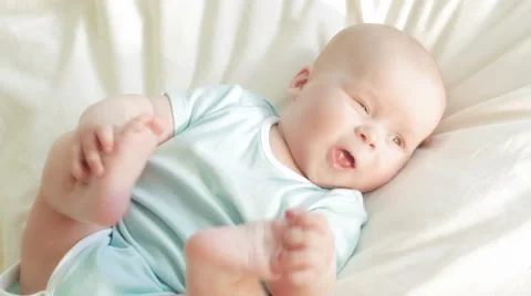 Child smiles to a sunbeam Stock Footage 63418188