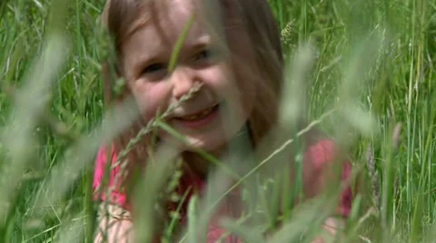 Child smiling in meadow Stock Footage 22664025