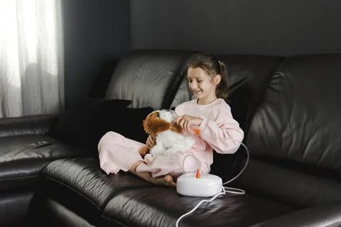 Child smiling while receiving asthma or cold treatment Stock Photos