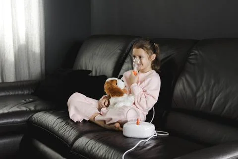 Child smiling while receiving asthma or cold treatment Stock Photos
